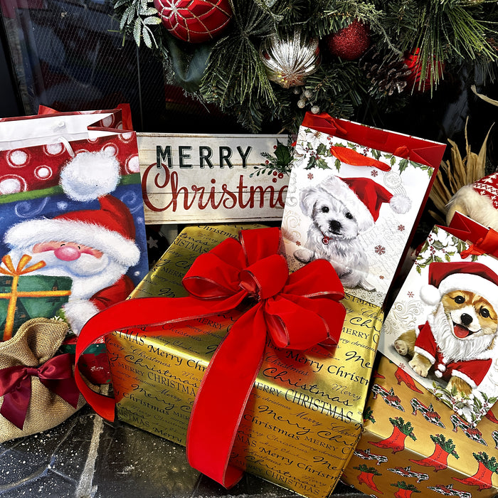 decorate  Christmas gifts with a large red velvet bow