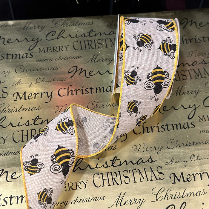 Decorative ribbon with bee pattern on a 'Merry Christmas' background