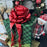 large metallic red bow on a large christmas gift
