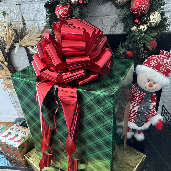 large metallic red bow on a large christmas gift