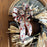 Decorative wreath with a star-themed bow on a wooden door.