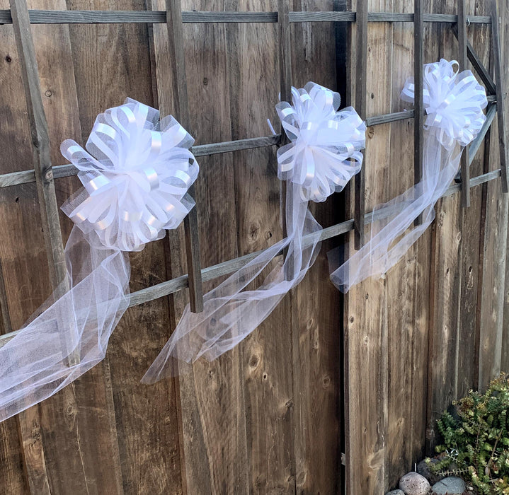 large white bows for beach and garden wedding party